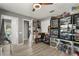 Bedroom with ceiling fan used as office and creative space to display collectibles at 6426 Montclair Bluff Ln, Windermere, FL 34786