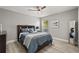 Comfortable bedroom featuring a dark wood headboard and soft blue bedding at 6426 Montclair Bluff Ln, Windermere, FL 34786