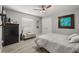 Comfortable bedroom featuring a ceiling fan, closet, and a cozy bench by the window at 6426 Montclair Bluff Ln, Windermere, FL 34786