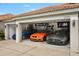 A spacious three-car garage with a collection of luxury automobiles, boasting ample space for car enthusiasts at 6426 Montclair Bluff Ln, Windermere, FL 34786