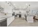 Open kitchen featuring white cabinets, stainless steel appliances, and granite countertops at 6426 Montclair Bluff Ln, Windermere, FL 34786