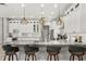Modern kitchen with a large island, pendant lighting, and white cabinets at 6426 Montclair Bluff Ln, Windermere, FL 34786