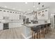 Spacious kitchen showcasing an island with seating and white cabinetry throughout at 6426 Montclair Bluff Ln, Windermere, FL 34786