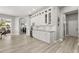 Expansive kitchen boasts white cabinetry, granite counters, and an open layout at 6426 Montclair Bluff Ln, Windermere, FL 34786