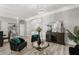 Sophisticated living room with modern furniture, elegant decor, and an open layout leading to the dining area at 6426 Montclair Bluff Ln, Windermere, FL 34786