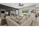 Cozy living room with a large sectional sofa and a view of the pool area at 6426 Montclair Bluff Ln, Windermere, FL 34786