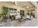 Stylish outdoor patio with comfortable seating, decorative plants, and views of the screened pool area at 6426 Montclair Bluff Ln, Windermere, FL 34786
