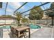 Inviting pool and spa surrounded by a screened enclosure, offering privacy and a relaxing outdoor space at 6426 Montclair Bluff Ln, Windermere, FL 34786