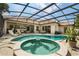 Stunning backyard featuring a pool, spa, screened enclosure, and multiple seating areas for entertaining at 6426 Montclair Bluff Ln, Windermere, FL 34786