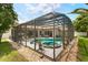 Stunning screened-in pool and spa area with outdoor furniture, creating an inviting space for leisure and enjoyment at 6426 Montclair Bluff Ln, Windermere, FL 34786