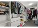 Spacious walk-in closet with custom shelving and ample storage for clothes, shoes, and accessories at 6426 Montclair Bluff Ln, Windermere, FL 34786
