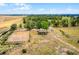 A sprawling equestrian estate features a well-maintained horse ring and surrounding trees at 9019 Tower Pine Dr, Winter Garden, FL 34787