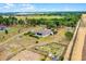 Beautiful aerial of a home on acreage with horse stables and training area at 9019 Tower Pine Dr, Winter Garden, FL 34787