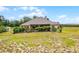 An inviting backyard with a pool, green grass, and nice landscaping at 9019 Tower Pine Dr, Winter Garden, FL 34787