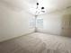 Bright bedroom with ceiling fan, neutral carpet, and two windows providing natural light at 9019 Tower Pine Dr, Winter Garden, FL 34787