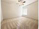 Spacious bedroom featuring neutral carpet, a ceiling fan, and ample natural light at 9019 Tower Pine Dr, Winter Garden, FL 34787