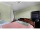 Bedroom featuring hardwood floors and neutral paint, offering a calm atmosphere at 9019 Tower Pine Dr, Winter Garden, FL 34787
