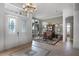 Inviting entryway features elegant tile flooring, high ceilings, and stylish wet bar at 9019 Tower Pine Dr, Winter Garden, FL 34787