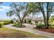 Stately home featuring circular driveway, lush landscaping, and beautiful architecture at 9019 Tower Pine Dr, Winter Garden, FL 34787