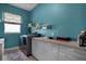 Functional laundry room with washer, dryer, sink, and storage solutions at 9019 Tower Pine Dr, Winter Garden, FL 34787