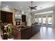 Spacious living room featuring a stone fireplace, built-in shelving, and a comfortable, inviting atmosphere at 9019 Tower Pine Dr, Winter Garden, FL 34787