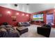 Spacious living room featuring a large screen and comfortable seating arrangements at 9019 Tower Pine Dr, Winter Garden, FL 34787