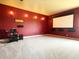 Large living room featuring carpet flooring, a projector screen, and ambient lighting at 9019 Tower Pine Dr, Winter Garden, FL 34787