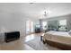 Bright bedroom boasts tile flooring, sliding glass doors, and ample natural light at 9019 Tower Pine Dr, Winter Garden, FL 34787