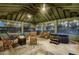 Enclosed outdoor room with hot tub, bar, hammock and seating area for relaxing outside at 9019 Tower Pine Dr, Winter Garden, FL 34787