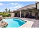 Resort style pool and screen enclosed lanai offers tranquil view of home and outdoor living at 9019 Tower Pine Dr, Winter Garden, FL 34787