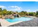 Beautiful pool featuring a rock waterfall, jacuzzi, and brick paver surround for luxurious outdoor living at 9019 Tower Pine Dr, Winter Garden, FL 34787