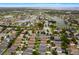 Beautiful aerial view of a neighborhood with lush landscaping, serene lakes, and well-maintained homes at 903 Tramells Trl, Kissimmee, FL 34744