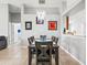 Elegant dining area featuring modern chandelier, artwork, and view into an open kitchen at 903 Tramells Trl, Kissimmee, FL 34744