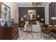 Well-appointed bedroom with a large mirror, stylish decor, and custom window treatments at 907 Sussex Close # 4, Orlando, FL 32804