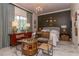 Nicely decorated bedroom featuring a seating area, custom window coverings, and stylish furniture at 907 Sussex Close # 4, Orlando, FL 32804