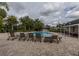 Inviting community pool area with lounge chairs, tables, and landscaping, perfect for relaxation and socializing at 907 Sussex Close # 4, Orlando, FL 32804