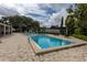 Well-maintained community pool with lounge chairs and landscaping, offering a refreshing escape for residents at 907 Sussex Close # 4, Orlando, FL 32804