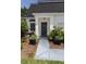Inviting front entrance with a stylish black door and manicured landscaping at 907 Sussex Close # 4, Orlando, FL 32804