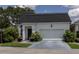 Charming single-story home with a two-car garage and well-maintained landscaping at 907 Sussex Close # 4, Orlando, FL 32804