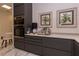 Kitchen featuring built-in stainless steel ovens, custom cabinets, and white countertops at 907 Sussex Close # 4, Orlando, FL 32804