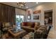 Comfortable living room with stylish decor, artwork, and access to outdoor space at 907 Sussex Close # 4, Orlando, FL 32804