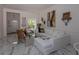 Inviting living room with a comfortable white sofa, marble floors, and stylish decor at 907 Sussex Close # 4, Orlando, FL 32804