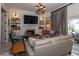 Cozy living room featuring a fireplace, built-in shelves, and stylish seating at 907 Sussex Close # 4, Orlando, FL 32804