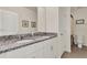 Bathroom featuring double sinks with granite countertops and ample storage space in a neutral palette at 11006 Sound Shore Dr, Winter Garden, FL 34787