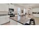 Modern kitchen boasting granite countertops, stainless appliances, and white cabinetry at 11006 Sound Shore Dr, Winter Garden, FL 34787