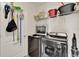 Functional laundry room with modern washer and dryer and organized storage solutions at 11006 Sound Shore Dr, Winter Garden, FL 34787