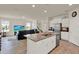 Open-concept layout featuring a kitchen with a large island, a living area, and neutral paint throughout at 11006 Sound Shore Dr, Winter Garden, FL 34787