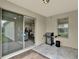 Covered patio with BBQ and sliding door into kitchen at 11006 Sound Shore Dr, Winter Garden, FL 34787