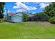 Lovely backyard features a screened pool enclosure, shed, mature trees, and plenty of green space at 1032 Silcox Branch Cir, Oviedo, FL 32765