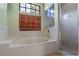 Lovely soaking tub with privacy window and tile surround, plus a walk-in shower at 1032 Silcox Branch Cir, Oviedo, FL 32765